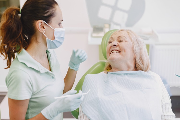 an old woman talking with dentist