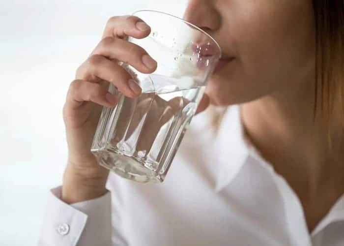 a woman drinking water