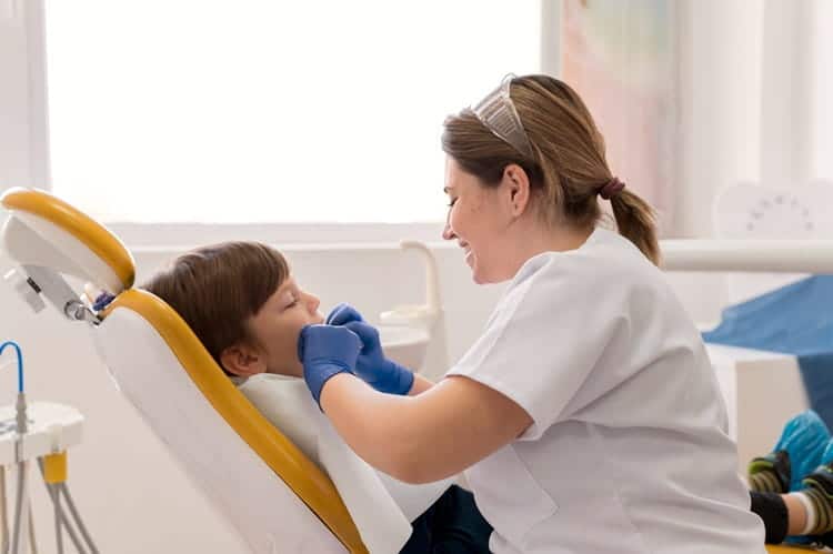 a child visiting by a dentist