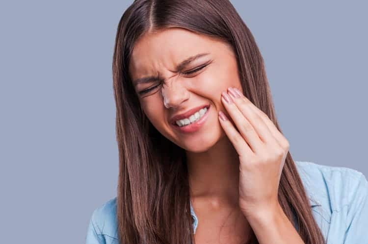 a woman having tooth pain