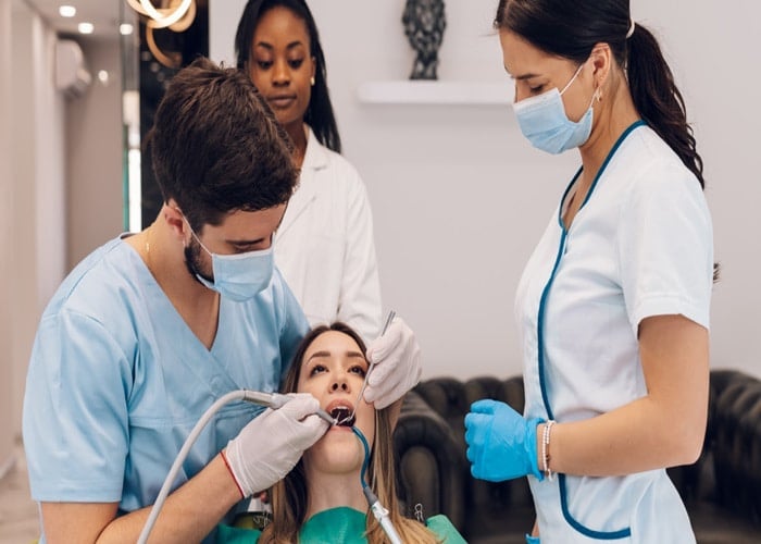 a dentist while treating a patient