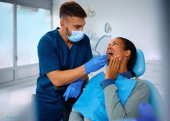 visiting a dentist for Swollen Gums After Tooth Extraction