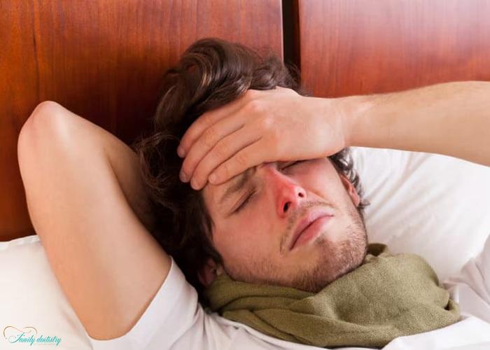 a man having fever after tooth extraction